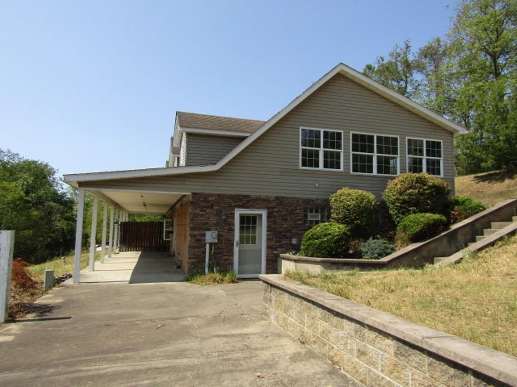 211 Lenkey Road Vanderbilt, PA 15486 - Photo 5 of 38 a front view of a house with a yard