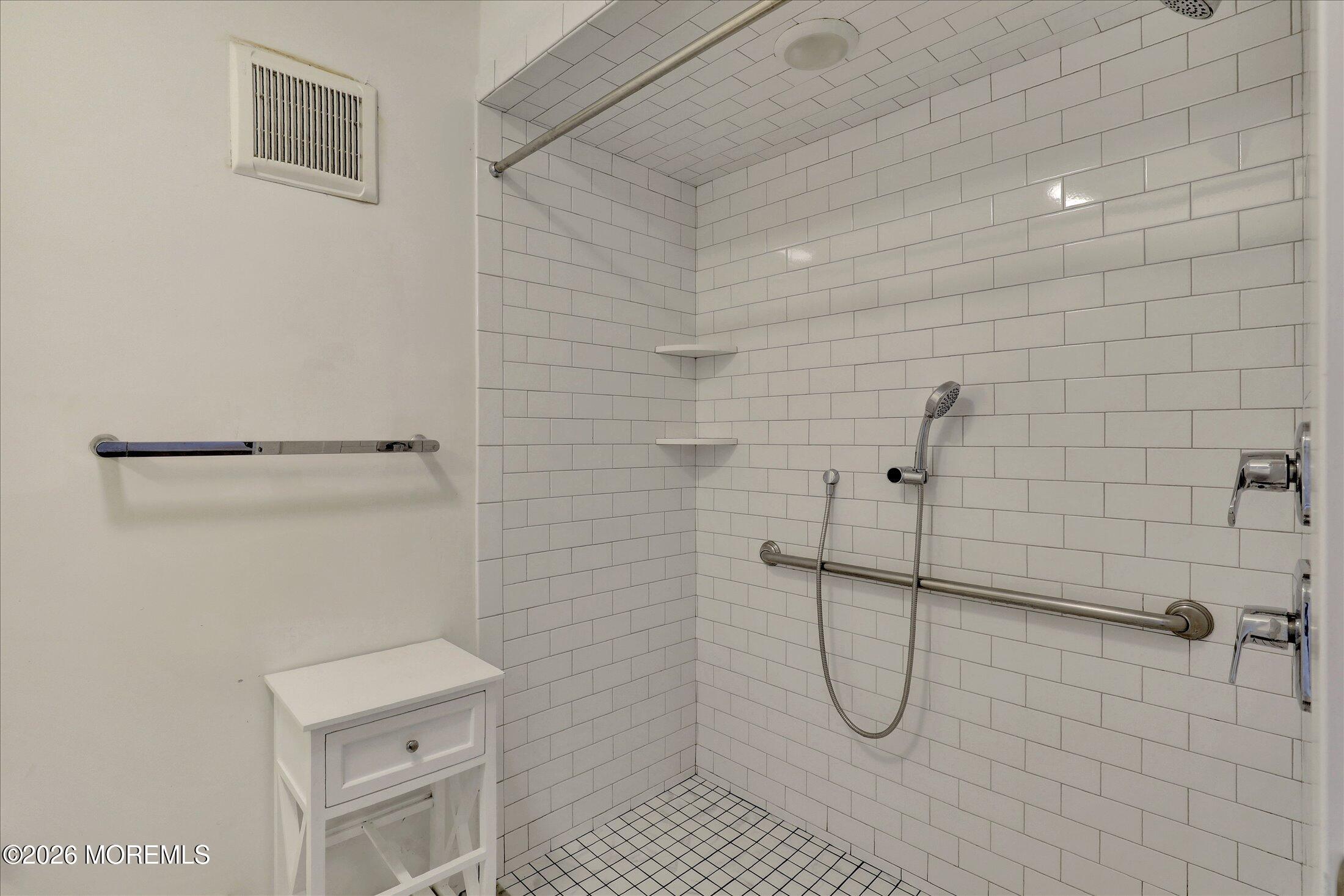55 Brighton Avenue, Unit 2 Long Branch, NJ 07740 - Photo 24 of 36 a bathroom with a shower