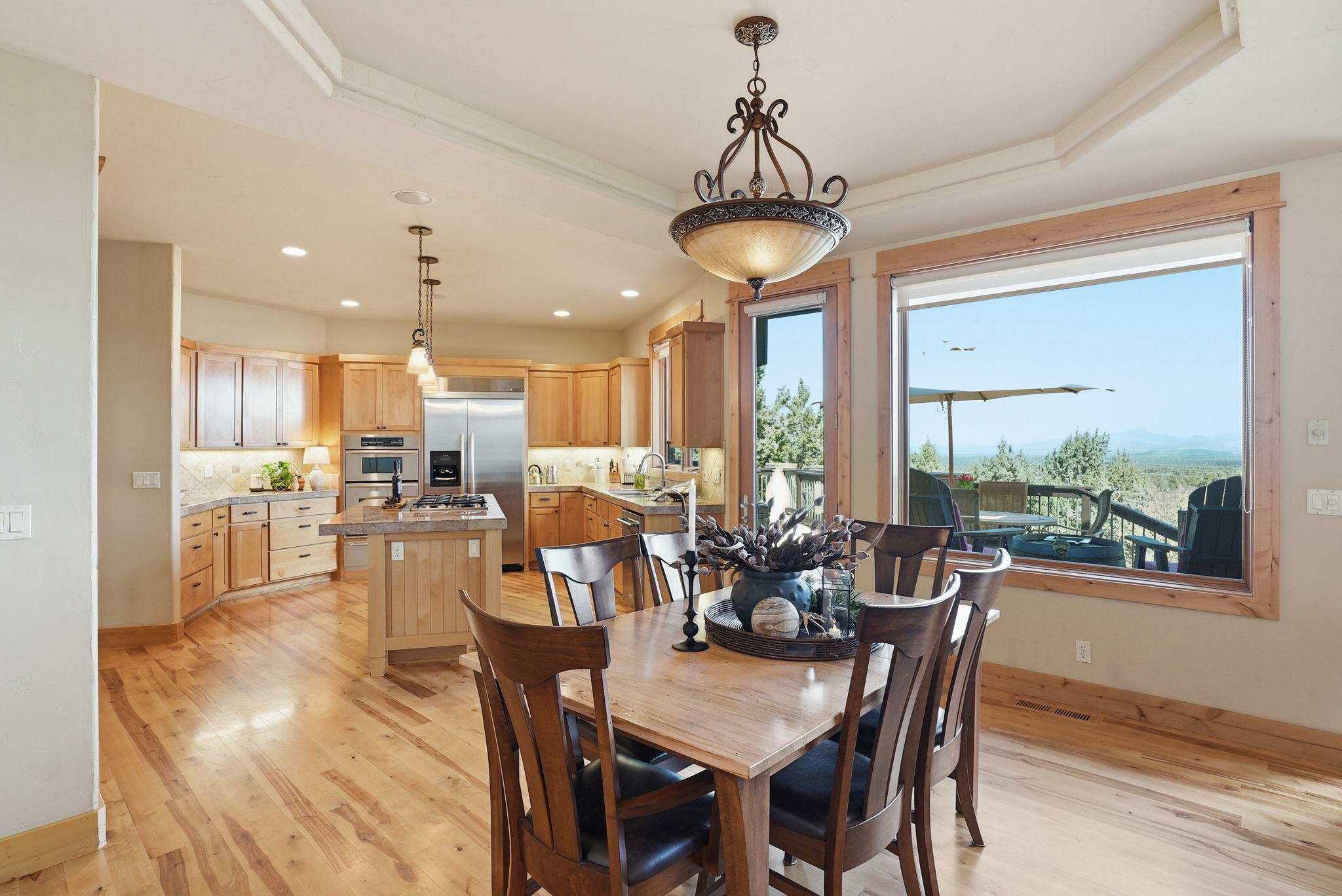 631 Sundance Ridge Court Redmond, OR 97756 - Photo 26 of 61 a view of a dining room with furniture window and outside view