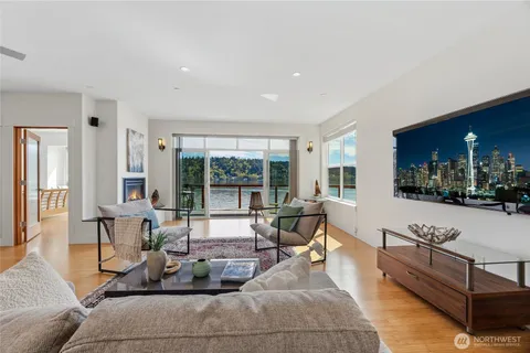 a living room with furniture and large windows
