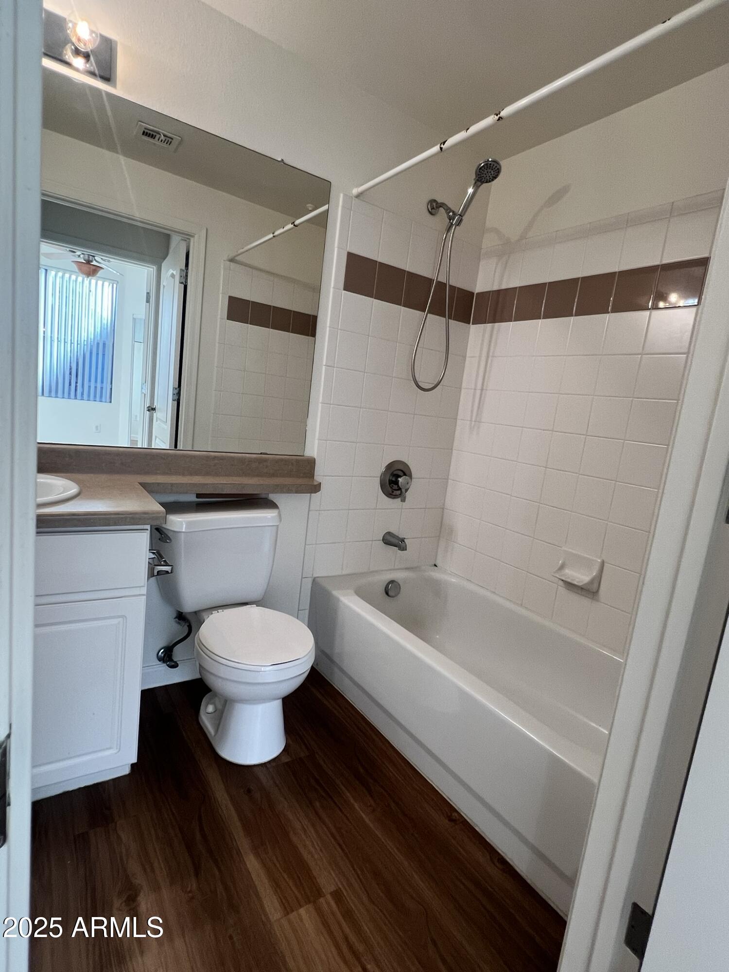 1701 East Colter Street, Unit 253 Phoenix, AZ 85016 - Photo 13 of 17 a bathroom with a toilet a sink and a bathtub