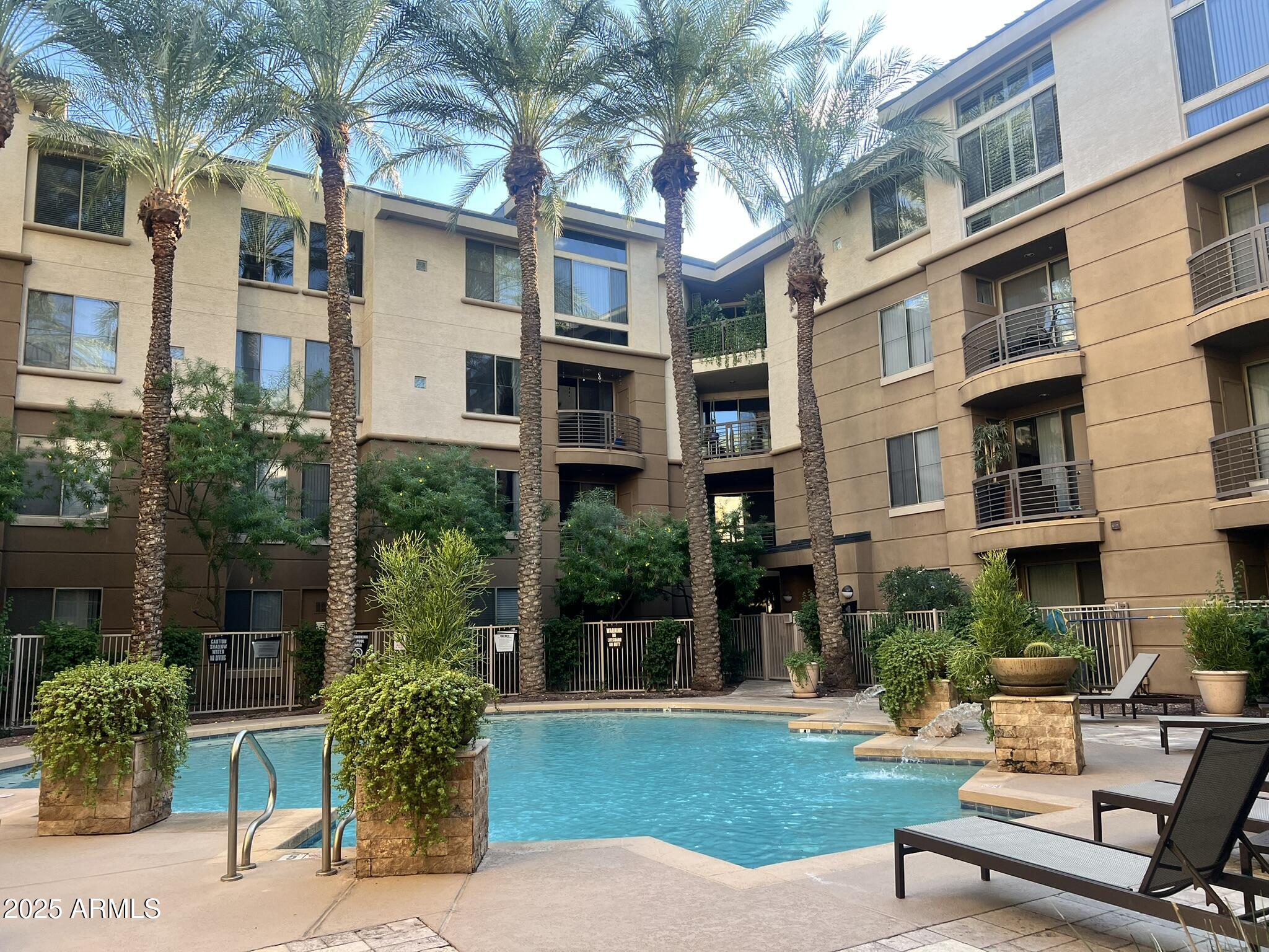 1701 East Colter Street, Unit 253 Phoenix, AZ 85016 - Photo 15 of 17 a view of a patio front of house