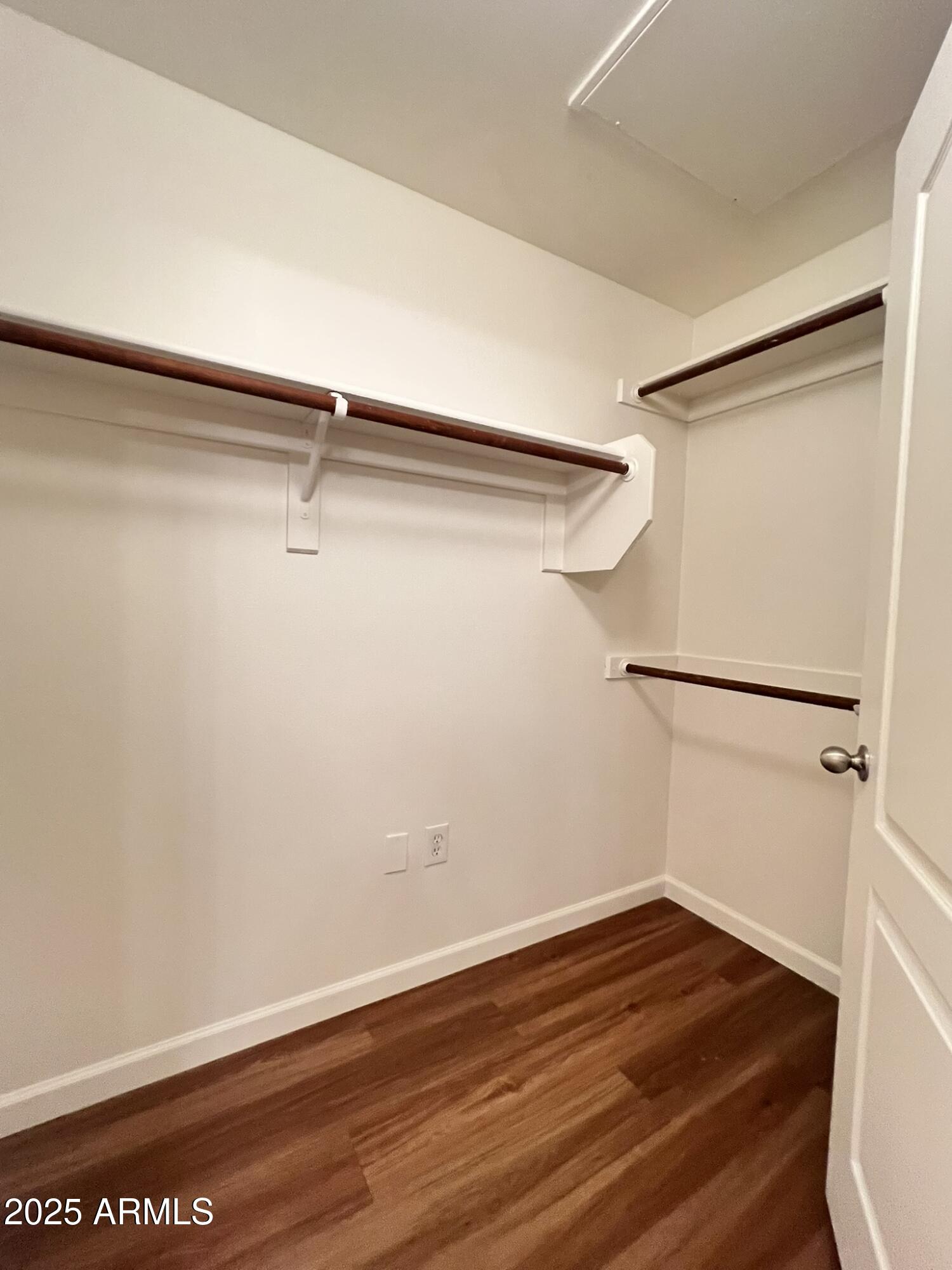 1701 East Colter Street, Unit 253 Phoenix, AZ 85016 - Photo 5 of 17 a view of a room with wooden floor