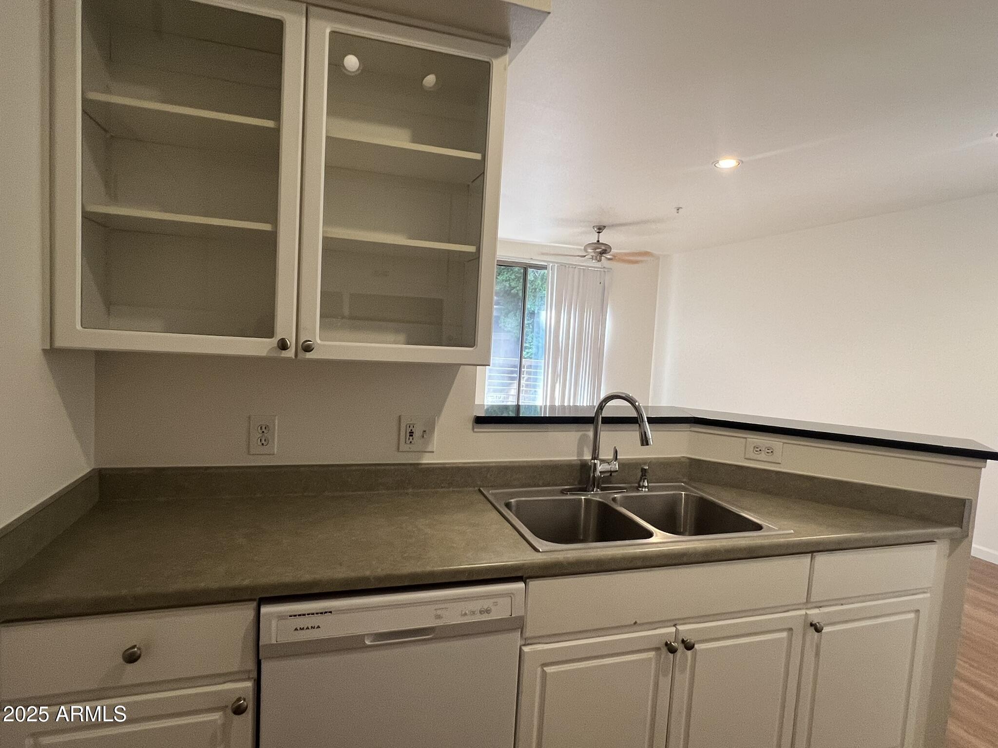 1701 East Colter Street, Unit 253 Phoenix, AZ 85016 - Photo 10 of 17 a kitchen with a sink and cabinets