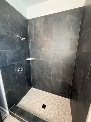 a bathroom with a sink and shower