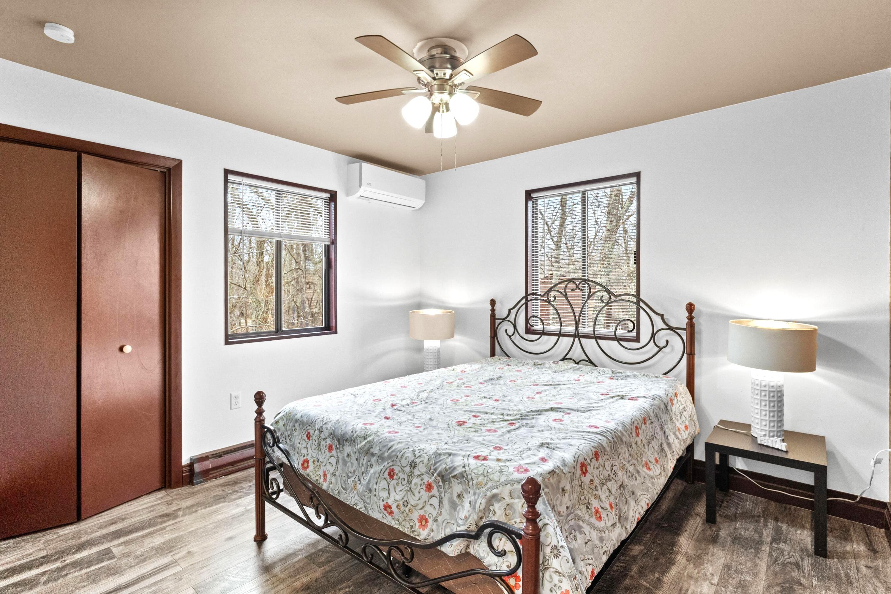 2196 Scarborough Way Bushkill, PA 18324 - Photo 16 of 58 a bedroom with a bed and a chandelier