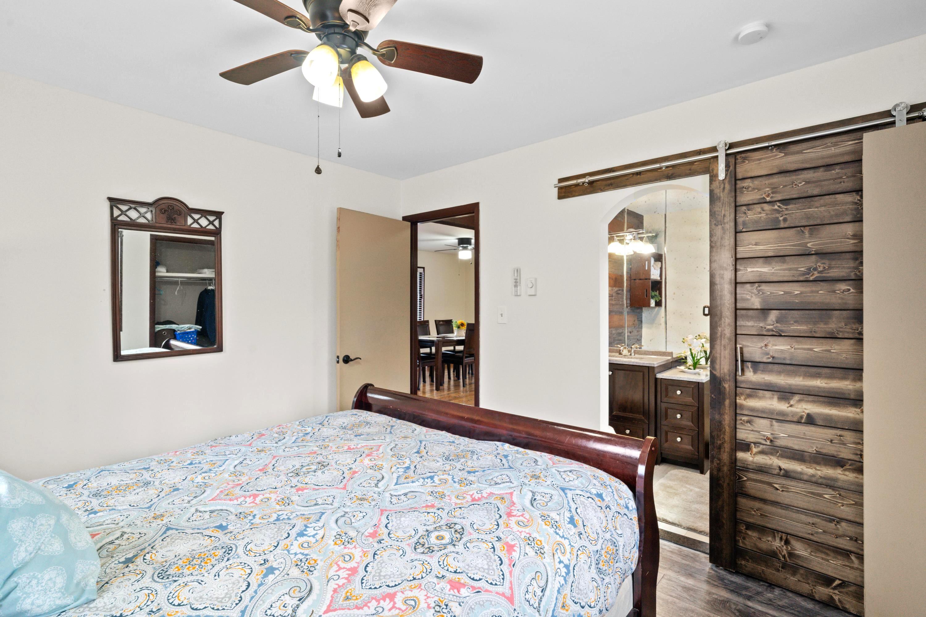 2196 Scarborough Way Bushkill, PA 18324 - Photo 18 of 58 a bedroom with a bed and a chandelier