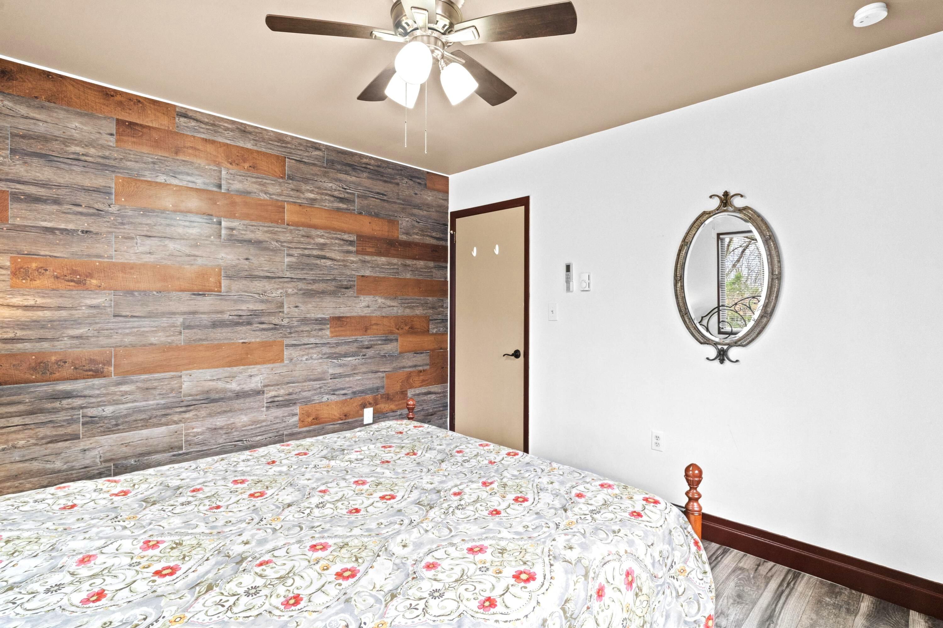 2196 Scarborough Way Bushkill, PA 18324 - Photo 21 of 58 a bedroom with a bed and a chandelier