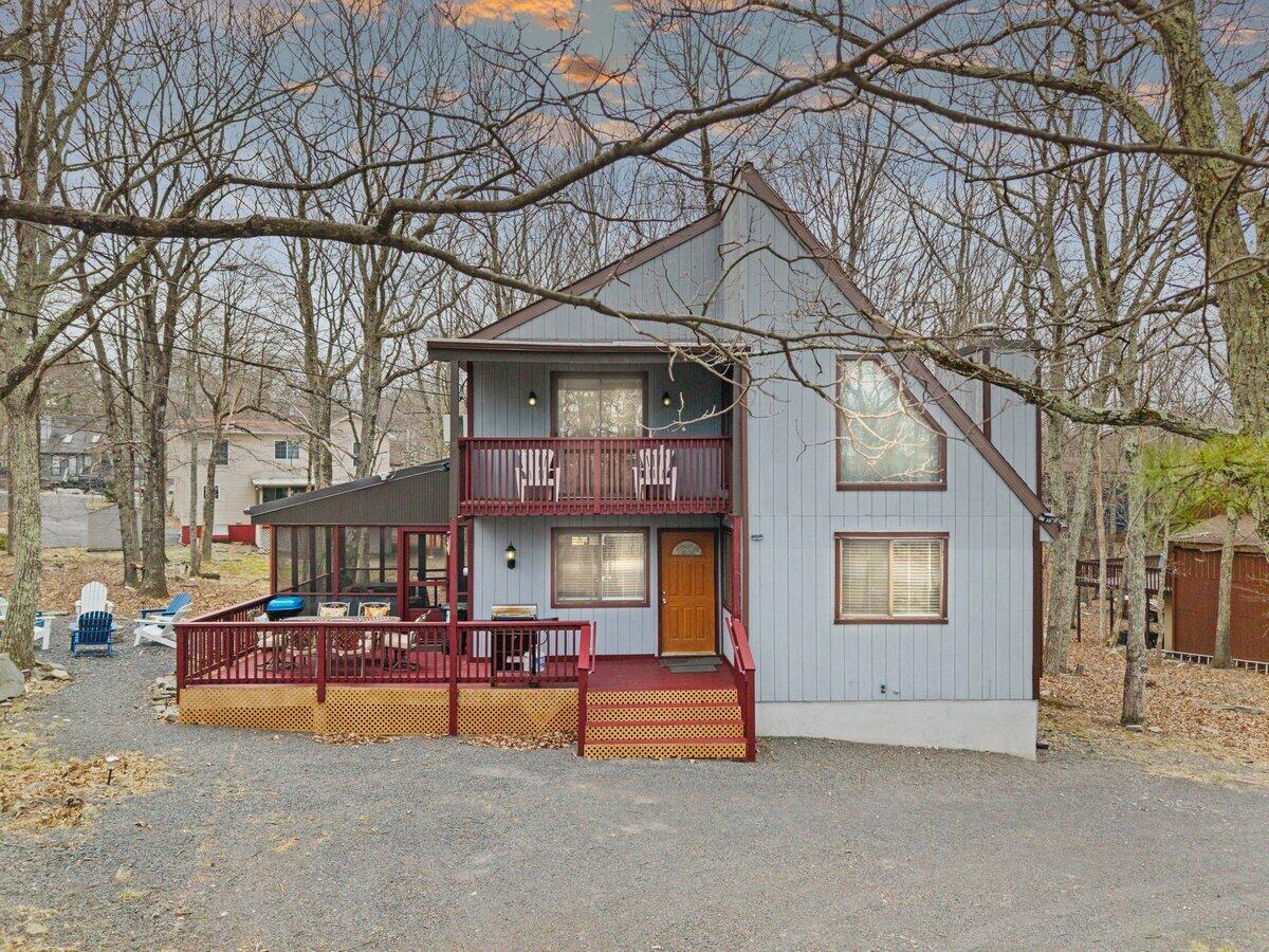 2196 Scarborough Way Bushkill, PA 18324 - Photo 22 of 58 a view of a house with a chairs and a fire pit
