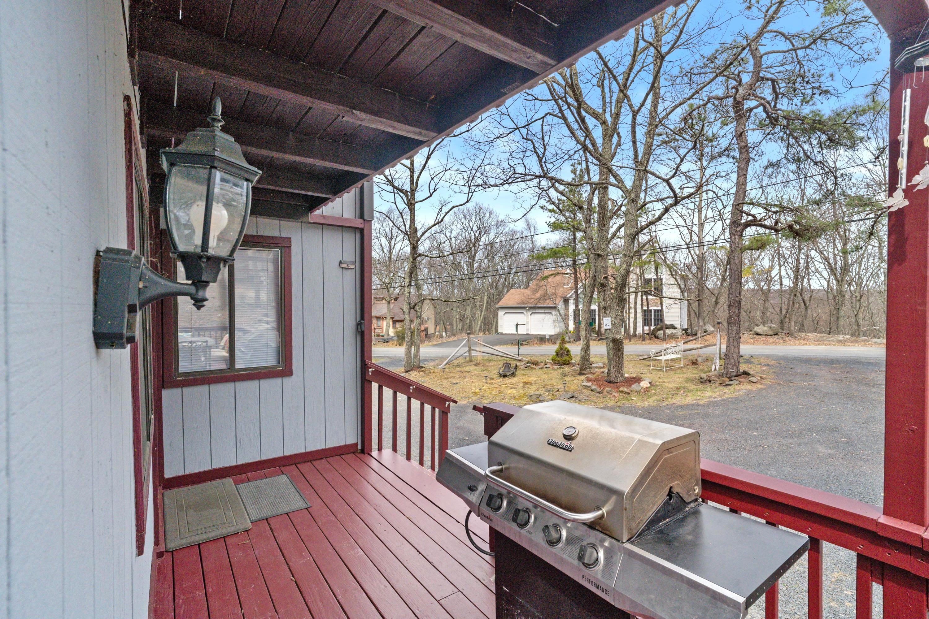 2196 Scarborough Way Bushkill, PA 18324 - Photo 28 of 58 a view of a deck with wooden floor and outdoor seating
