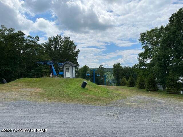 2196 Scarborough Way Bushkill, PA 18324 - Photo 40 of 58 a view of a backyard with a garden