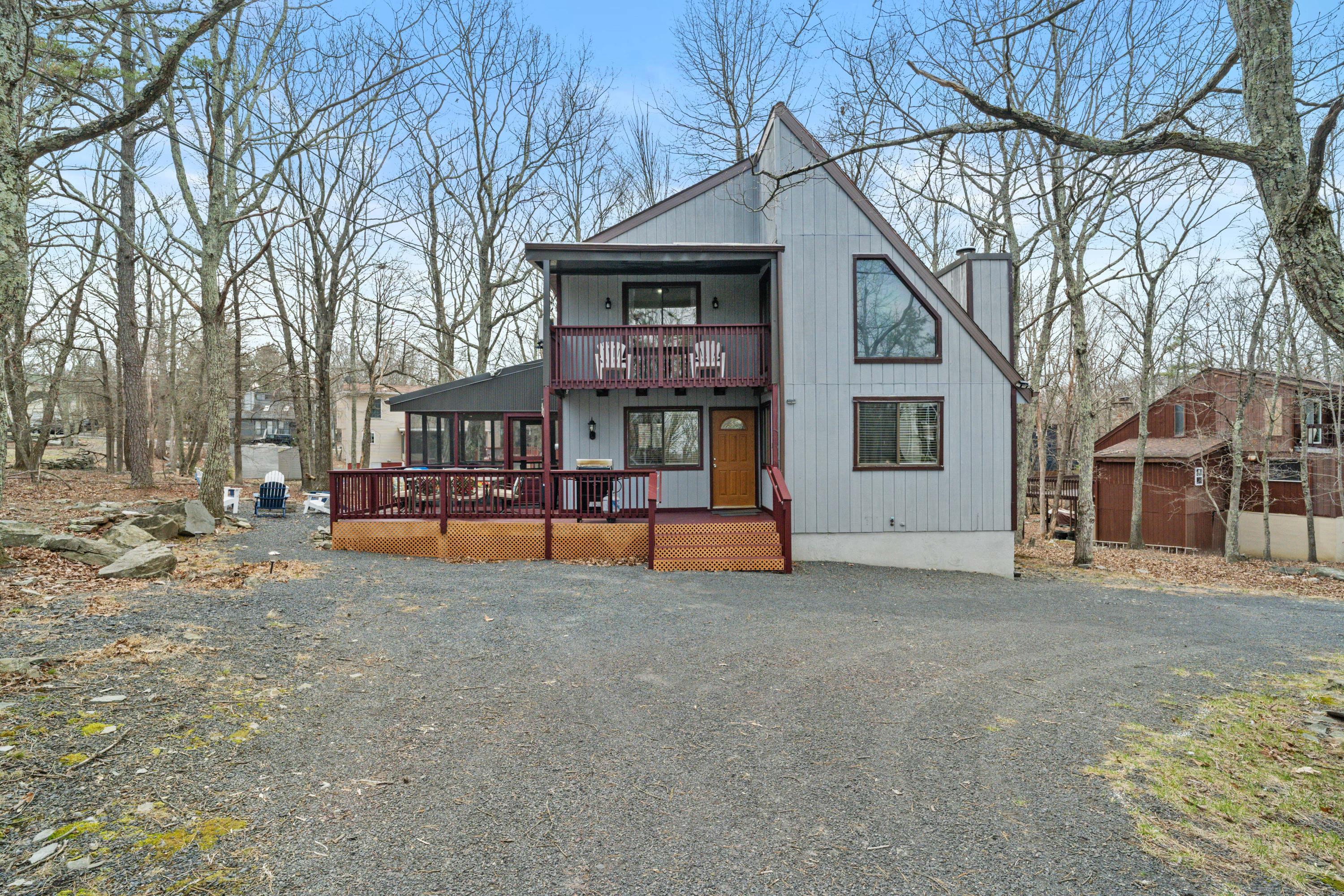 2196 Scarborough Way Bushkill, PA 18324 - Photo 50 of 58 a view of a house with a yard covered in snow