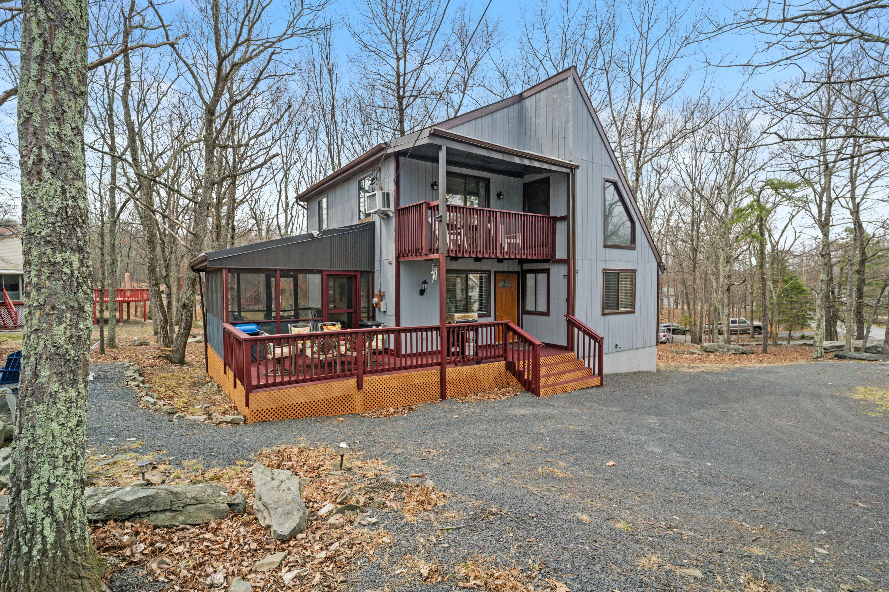 2196 Scarborough Way Bushkill, PA 18324 - Photo 52 of 58 a view of a house with backyard and sitting area