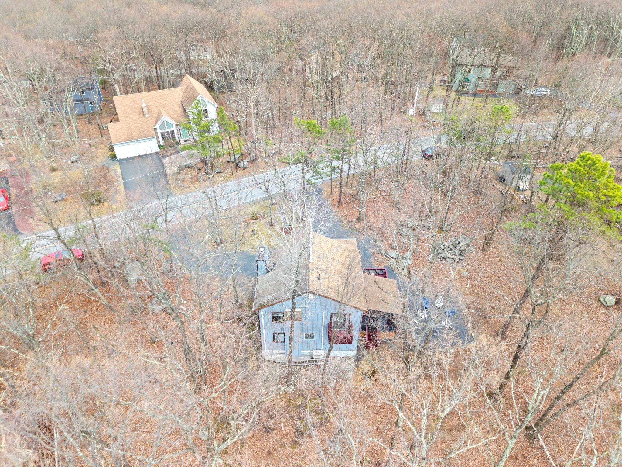 2196 Scarborough Way Bushkill, PA 18324 - Photo 56 of 58 a aerial view of a house with a yard and large trees