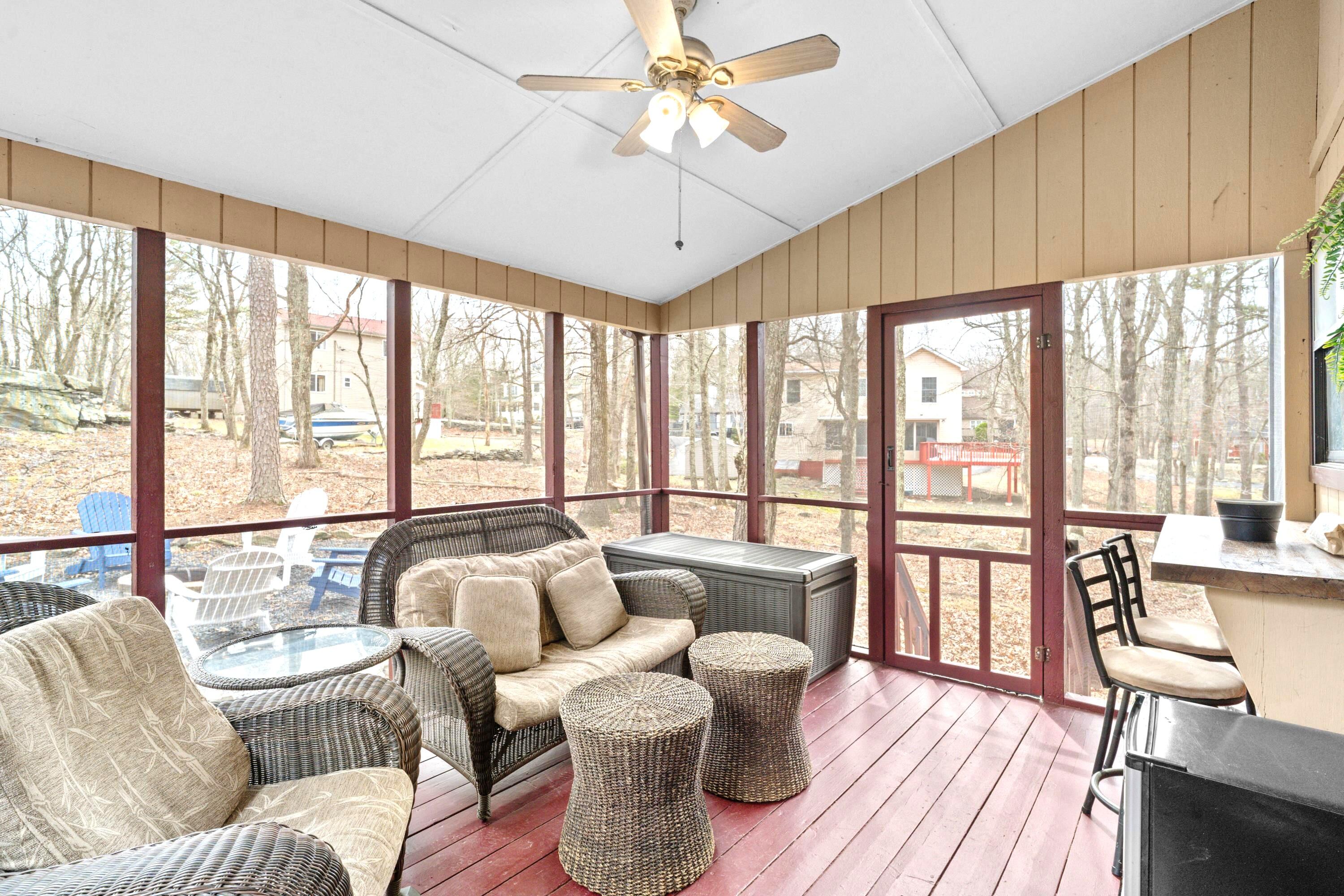 2196 Scarborough Way Bushkill, PA 18324 - Photo 9 of 58 a living room with furniture and a large window with wooden floor