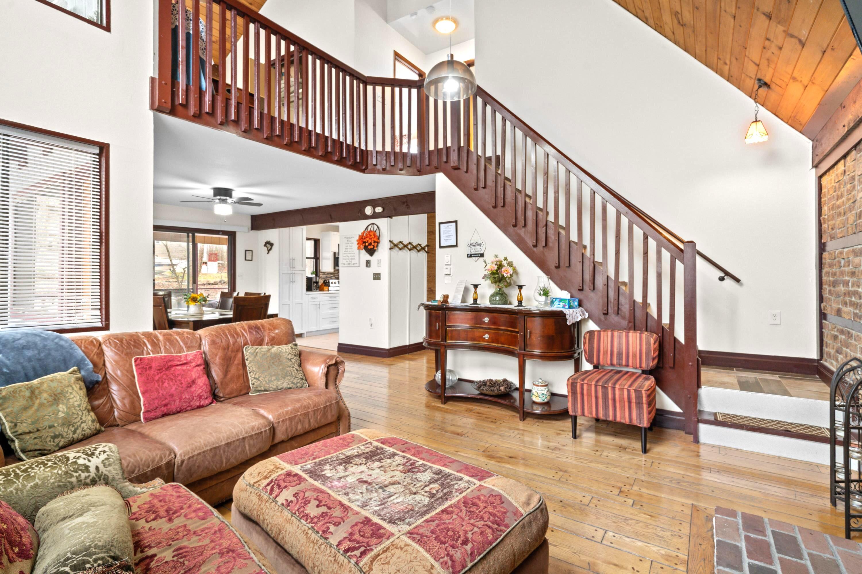2196 Scarborough Way Bushkill, PA 18324 - Photo 10 of 58 a living room with furniture or stairs and a rug
