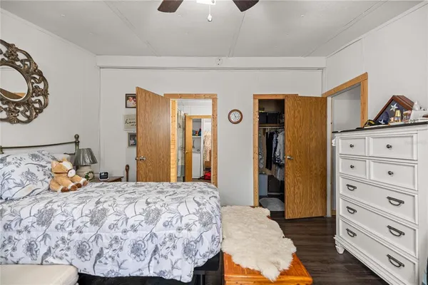 a bedroom with a bed and dresser
