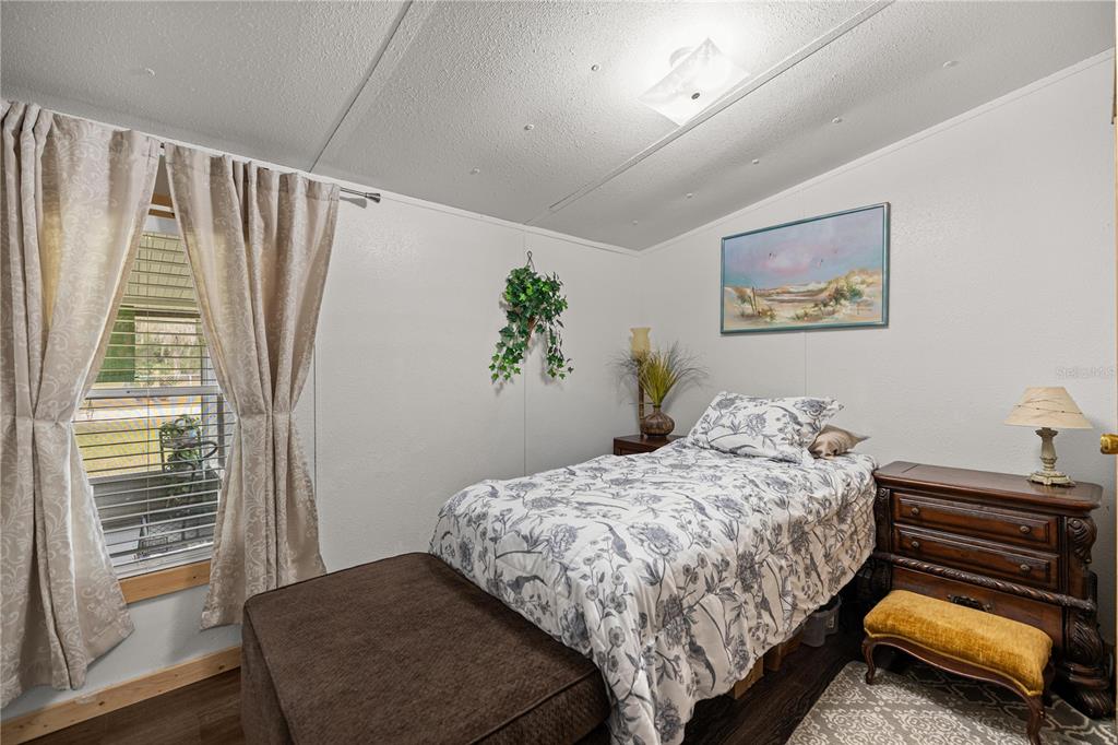 17172 Northeast 37th Terrace Citra, FL 32113 - Photo 2 of 38 a bedroom with a bed and a window