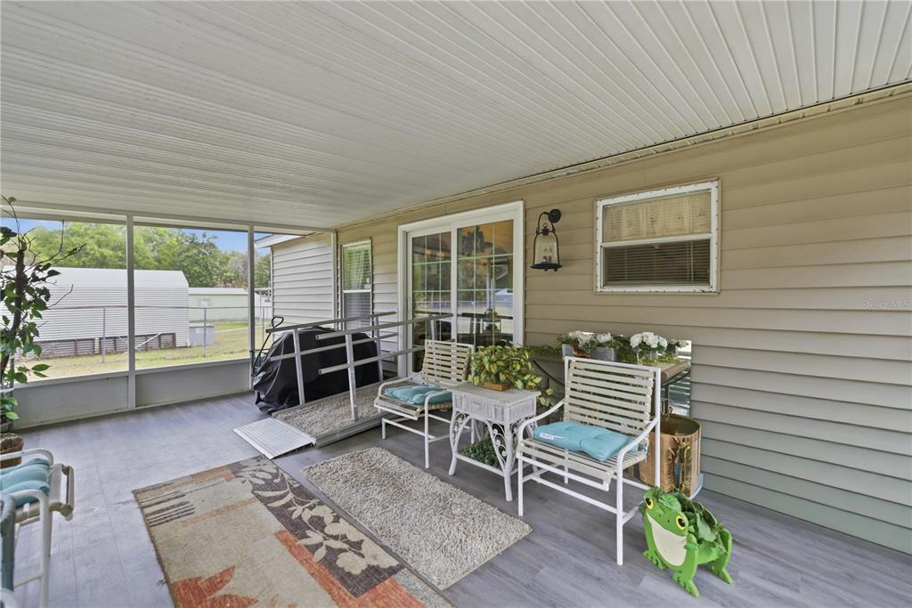 17172 Northeast 37th Terrace Citra, FL 32113 - Photo 27 of 38 a outdoor living space with furniture and a potted plant