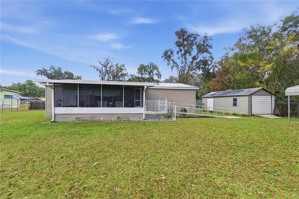 17172 Northeast 37th Terrace Citra, FL 32113 - Photo 35 of 38 a front view of house with yard and seating area