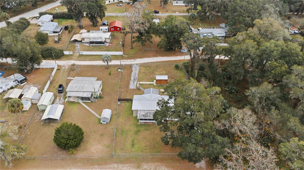 17172 Northeast 37th Terrace Citra, FL 32113 - Photo 37 of 38 an aerial view of residential houses with outdoor space and parking