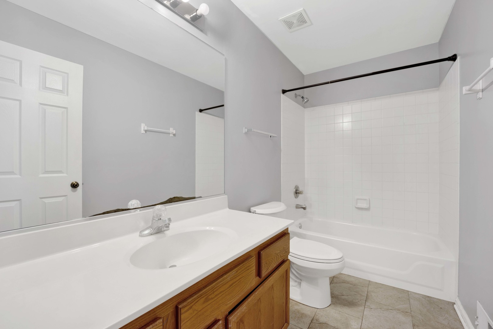 2571 Eldorado Lane, Unit 1 Naperville, IL 60564 - Photo 14 of 21 a bathroom with a sink toilet and shower