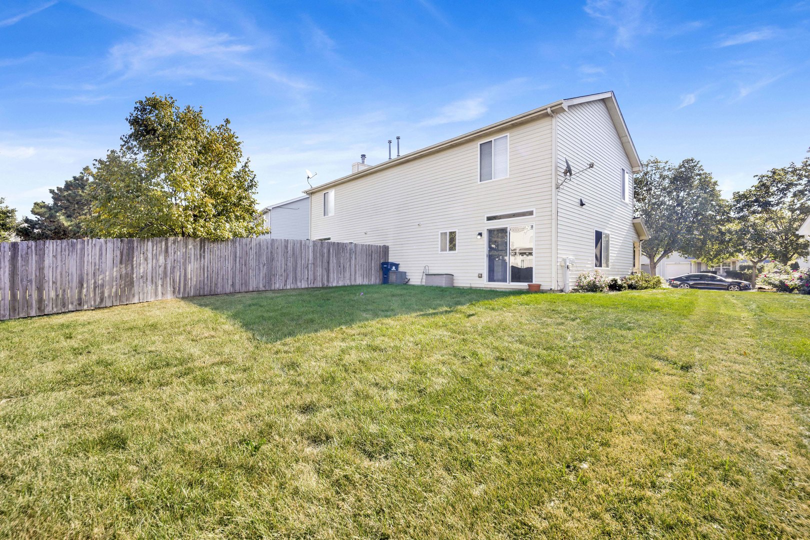 2571 Eldorado Lane, Unit 1 Naperville, IL 60564 - Photo 19 of 21 a view of a house with backyard and trees