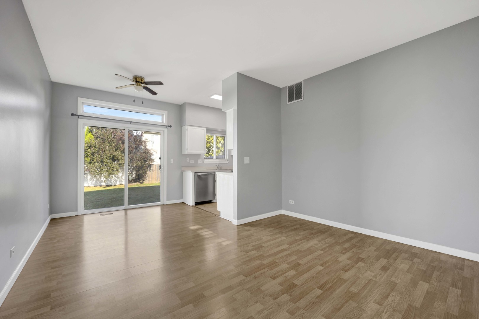 2571 Eldorado Lane, Unit 1 Naperville, IL 60564 - Photo 3 of 21 wooden floor in an empty room with a window