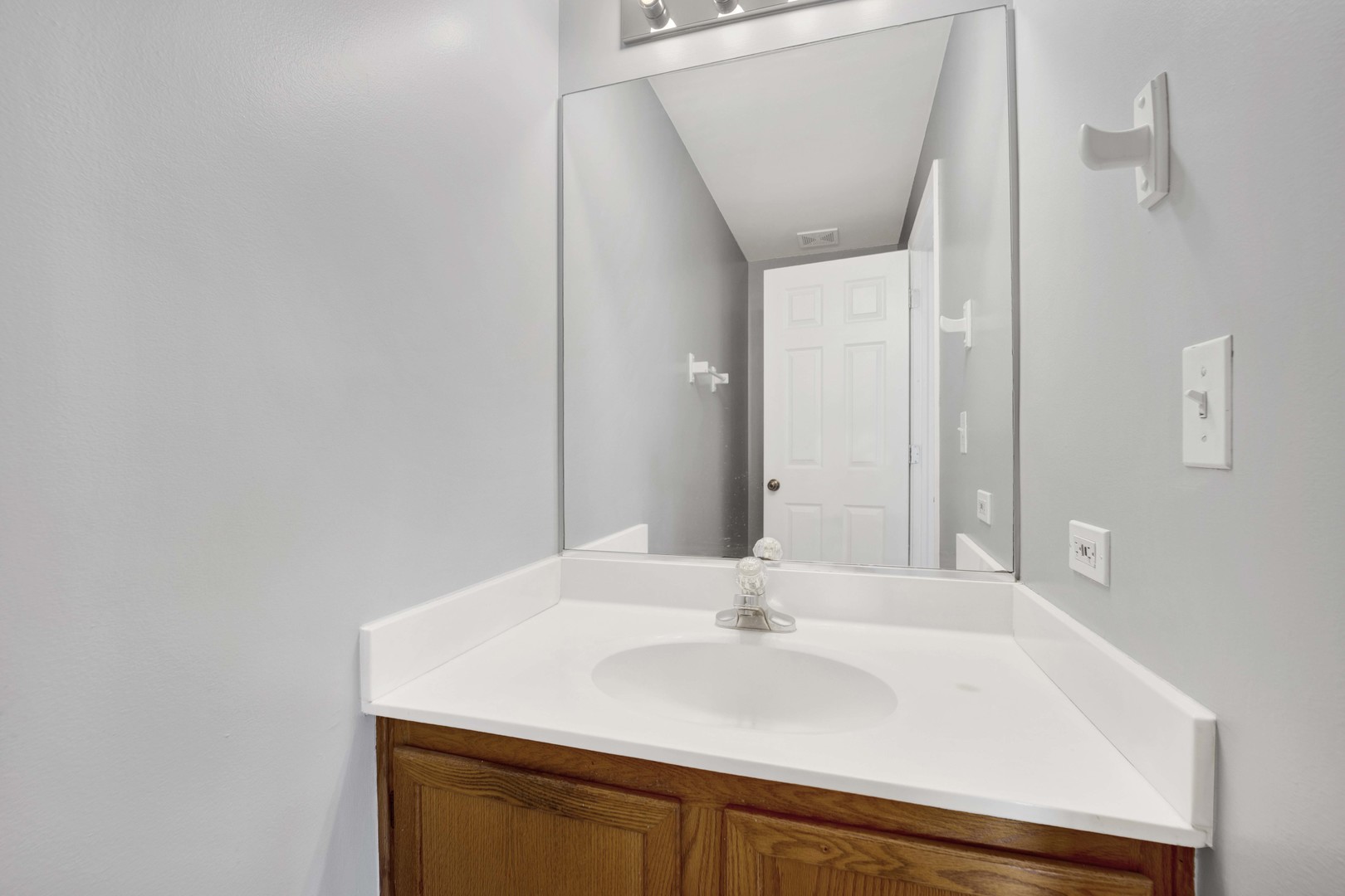 2571 Eldorado Lane, Unit 1 Naperville, IL 60564 - Photo 9 of 21 a bathroom with a sink and a mirror