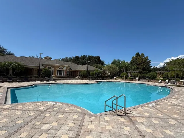 a view of a swimming pool with lounge chair