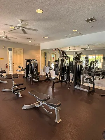 a room with gym equipment and a large window