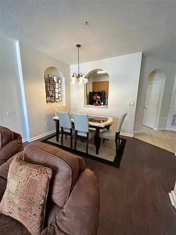 a bedroom with furniture and a wooden floor
