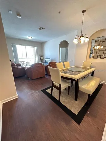 a dining room with furniture and window