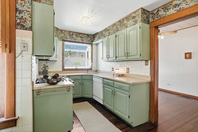 a kitchen with a sink and cabinets