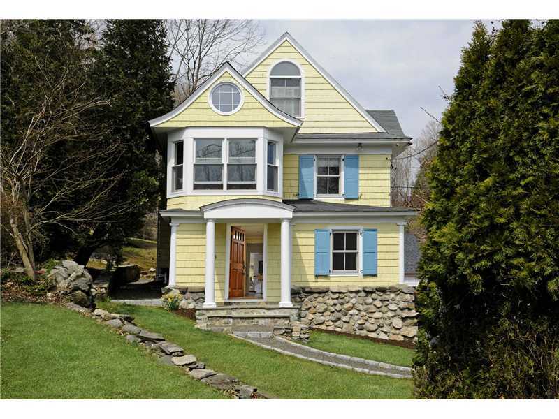 226 Valley Road Cos Cob, CT 06807 - Photo 1 of 17 a front view of a house with a yard