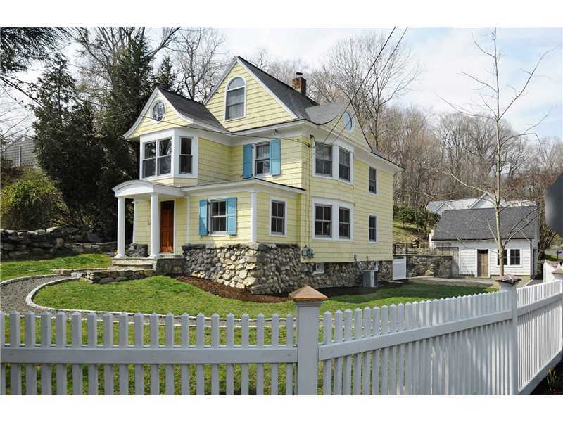 226 Valley Road Cos Cob, CT 06807 - Photo 17 of 17 a front view of a house with garden