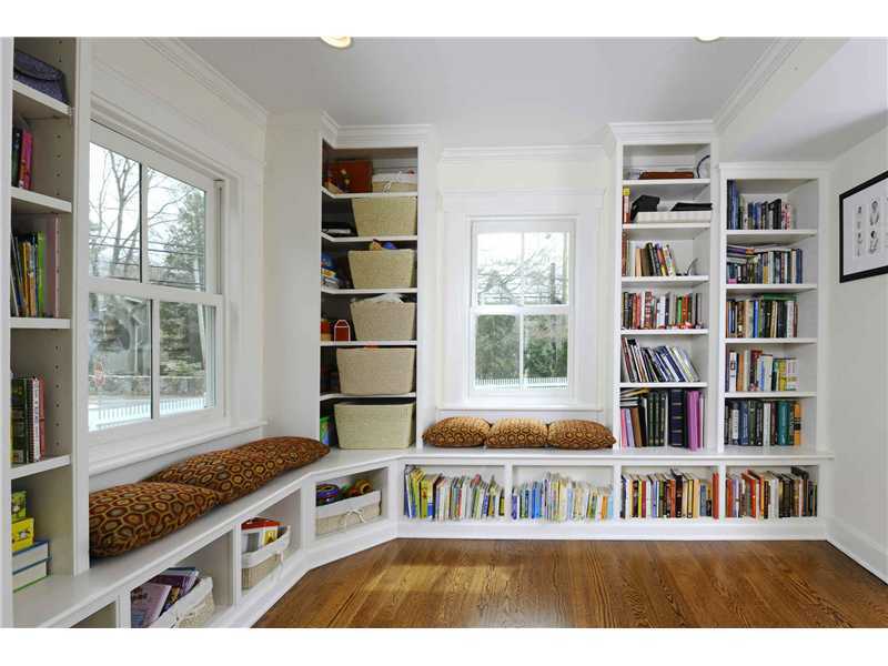 226 Valley Road Cos Cob, CT 06807 - Photo 4 of 17 a room with furniture and a book shelf