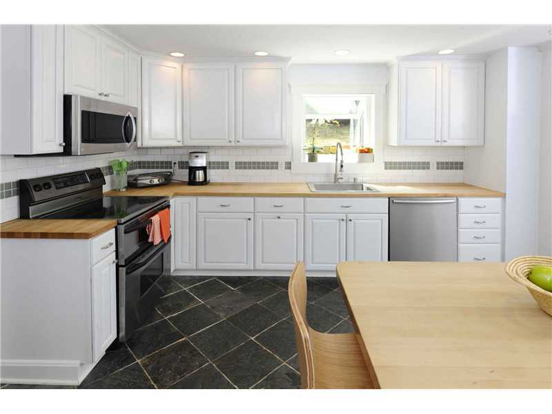 226 Valley Road Cos Cob, CT 06807 - Photo 6 of 17 a kitchen with a sink window and cabinets