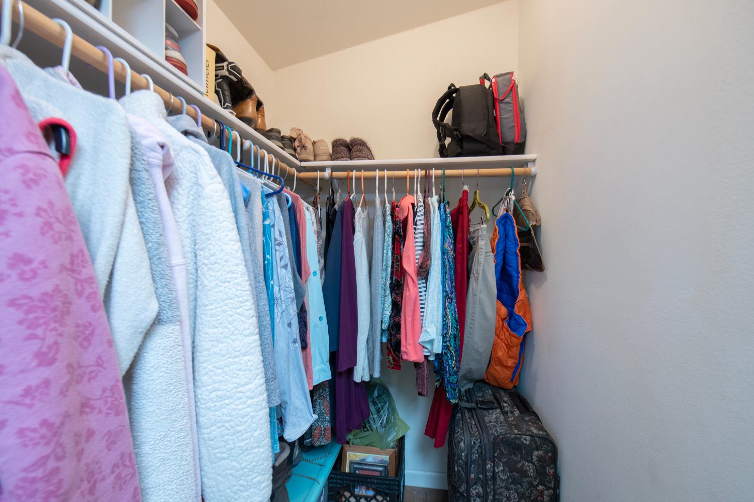 33751 Powerhouse Road, Unit 21 Auberry, CA 93602 - Photo 13 of 29 a view of walk in closet with clothes and shoes