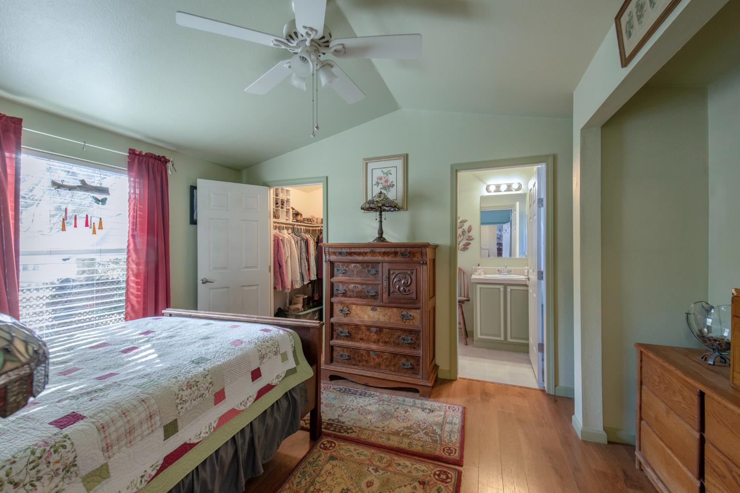 33751 Powerhouse Road, Unit 21 Auberry, CA 93602 - Photo 14 of 29 a bedroom with a bed and a dresser