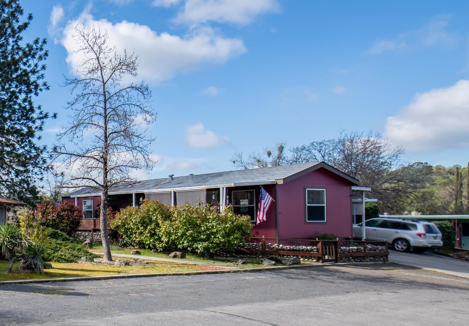 33751 Powerhouse Road, Unit 21 Auberry, CA 93602 - Photo 26 of 29 a front view of a house with a garden