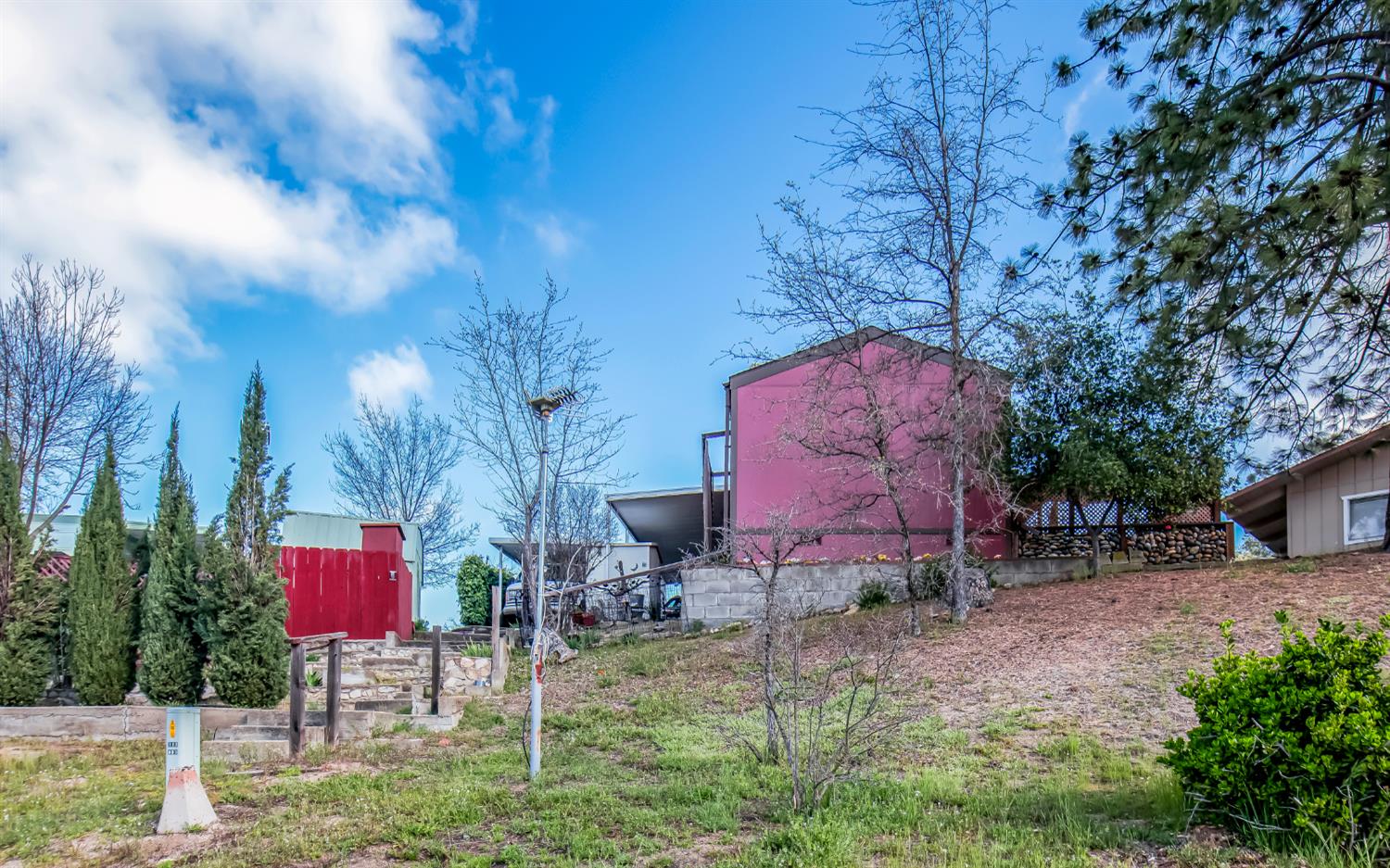 33751 Powerhouse Road, Unit 21 Auberry, CA 93602 - Photo 27 of 29 a backyard of a house with lots of green space