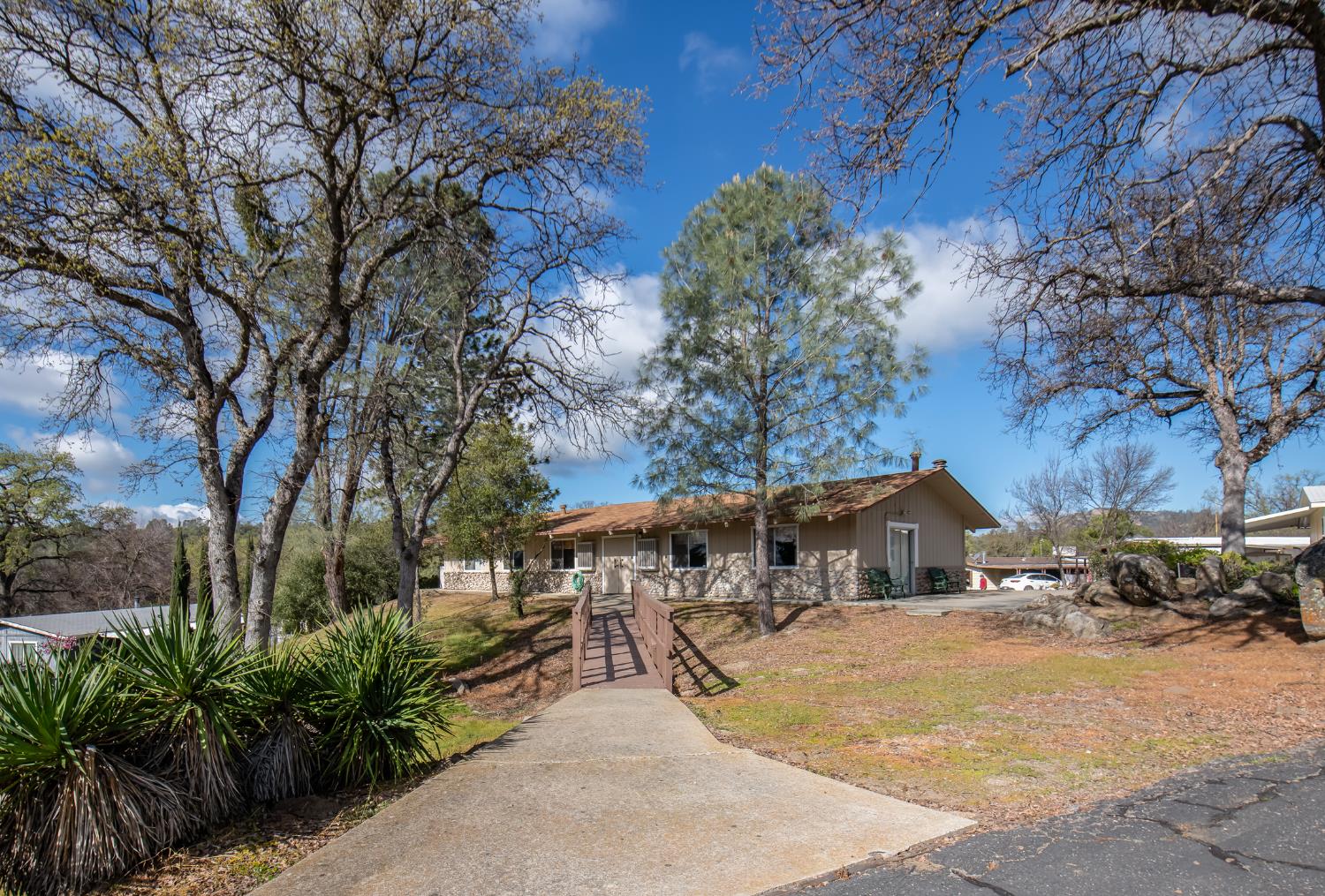 33751 Powerhouse Road, Unit 21 Auberry, CA 93602 - Photo 29 of 29 a front view of a house with a yard