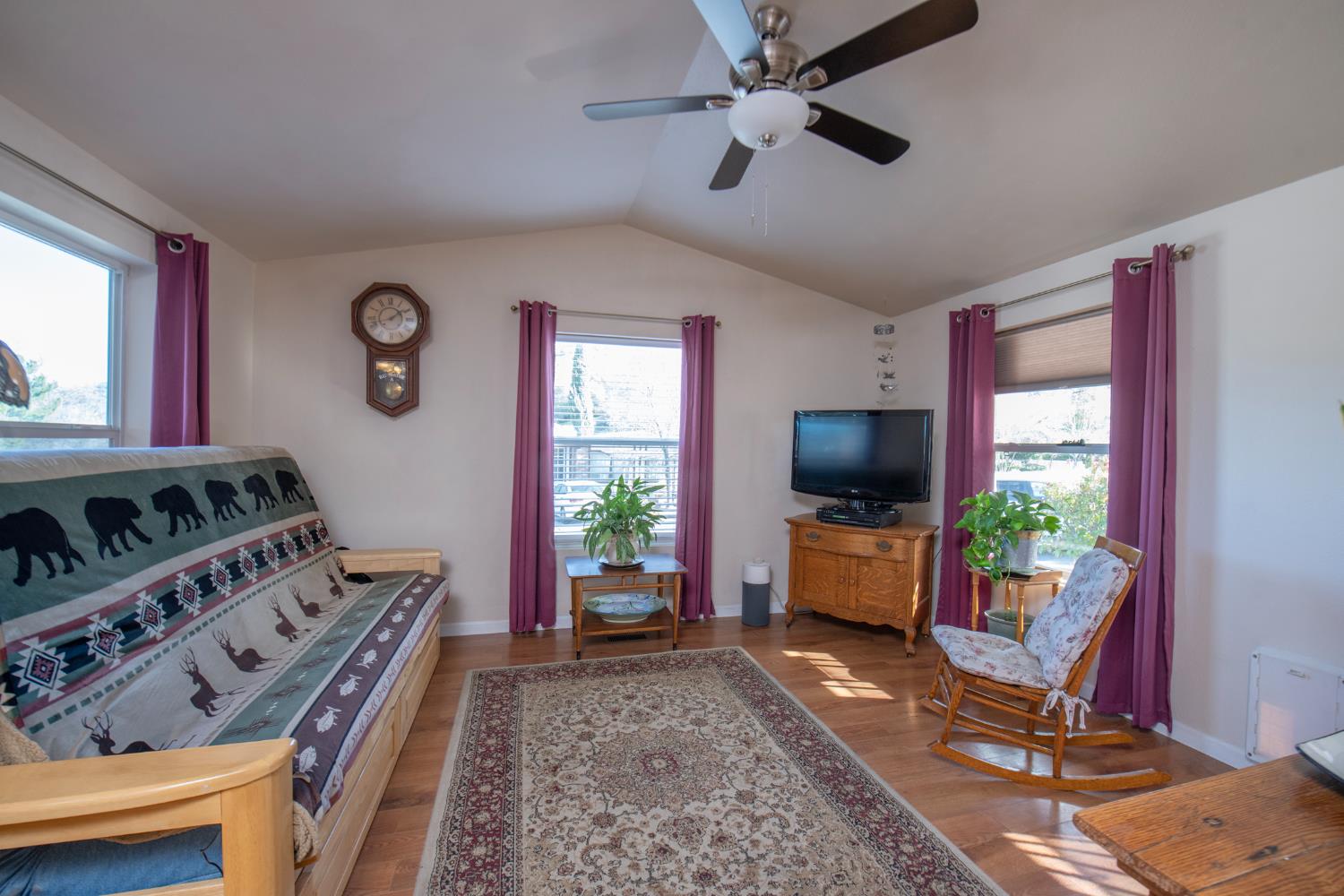 33751 Powerhouse Road, Unit 21 Auberry, CA 93602 - Photo 5 of 29 a living room with furniture and a flat screen tv