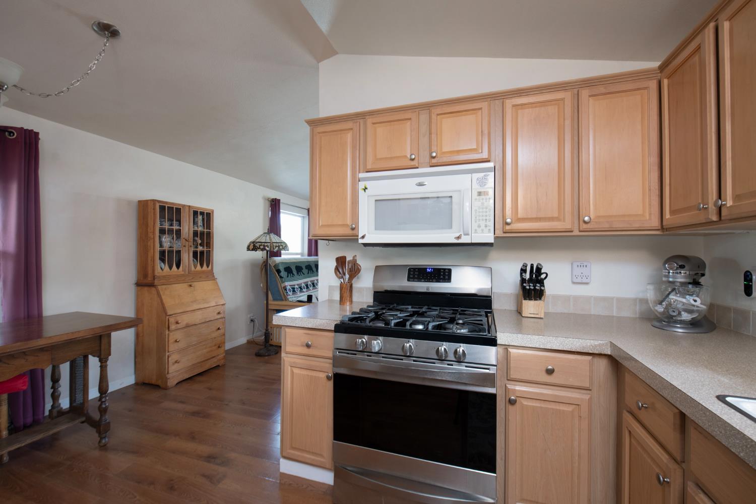 33751 Powerhouse Road, Unit 21 Auberry, CA 93602 - Photo 8 of 29 a kitchen with cabinets appliances and a counter space