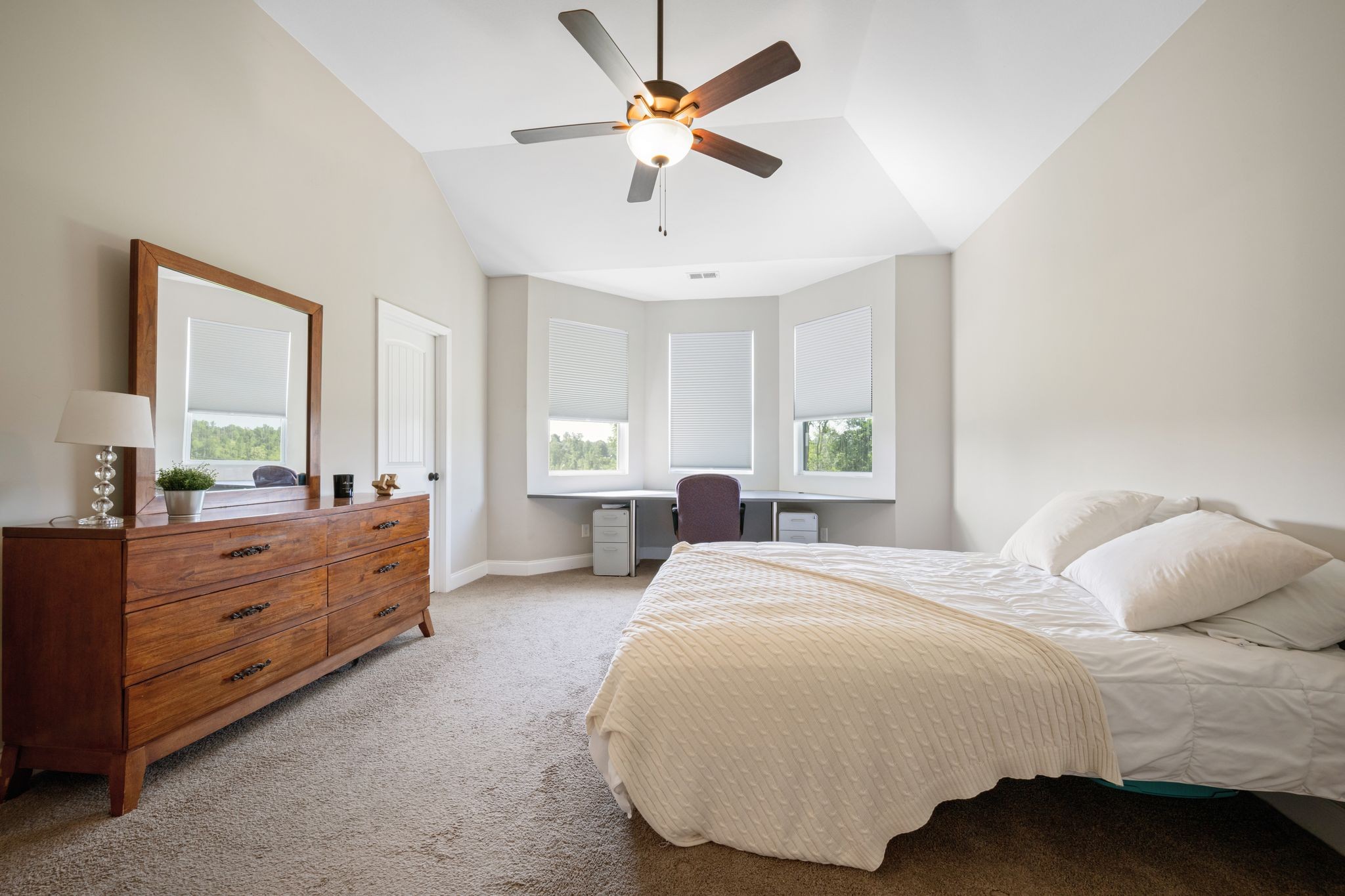 102 Murrell Road Dickson, TN 37055 - Photo 12 of 23 a bedroom with a bed and a chandelier fan