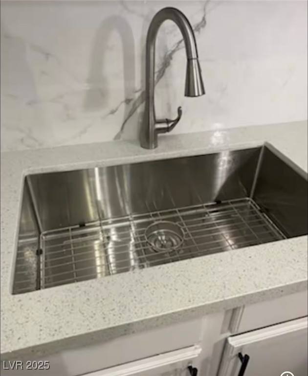 615 South Royal Crest Circle, Unit 8 Las Vegas, NV 89169 - Photo 3 of 11 Kitchen view of light stone countertops and a sink