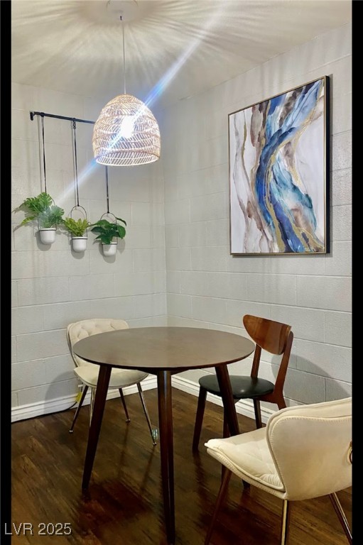 615 South Royal Crest Circle, Unit 8 Las Vegas, NV 89169 - Photo 6 of 11 Dining area featuring concrete block wall and wood
