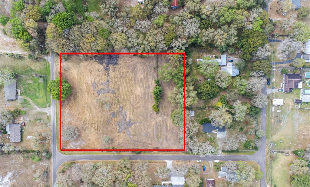 1206 Fisher Lane Brandon, FL 33510 - Photo 16 of 22 a small white building with a trees in front of it