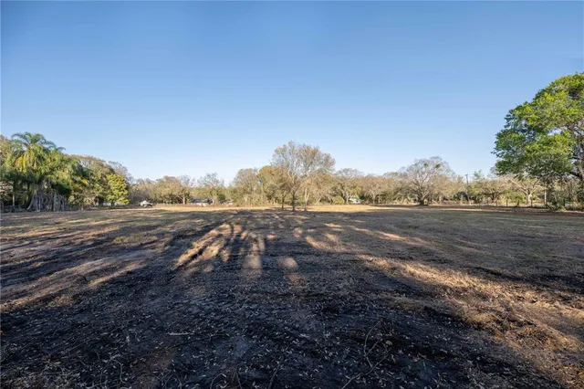 a view of dirt yard and mountain view